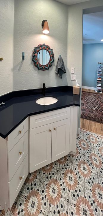 Vanity with black countertop