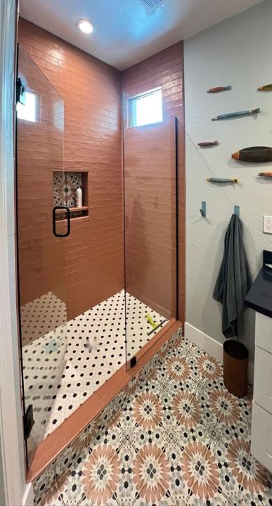 Shower and patterned tile floor