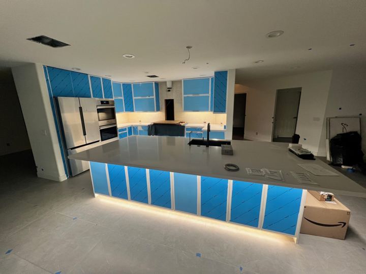 New island with lighting, cabinets still in protective film