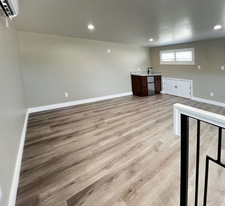 Loft toward the wet bar and storage doors