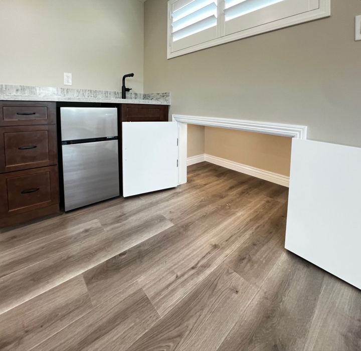 Wet bar with mini fridge and under-eave storage