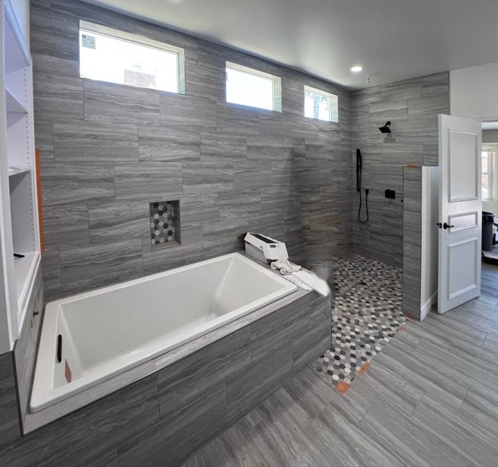 Tub deck and curbless shower