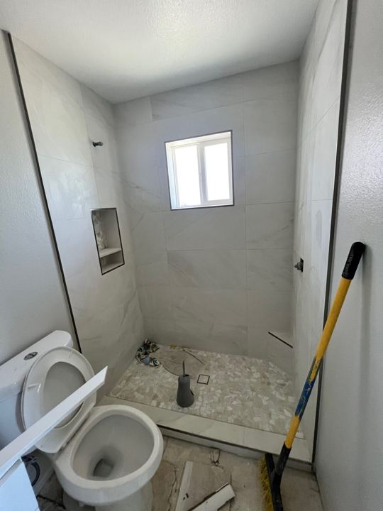 Shower tile and pebble floor