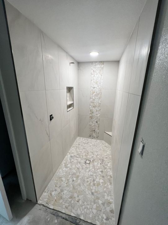 Walk-in shower tiled