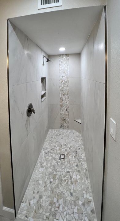 Walk-in shower with pebble floor