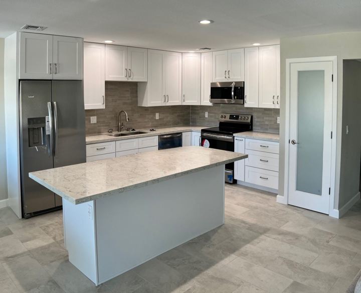 White shaker kitchen and quartz island