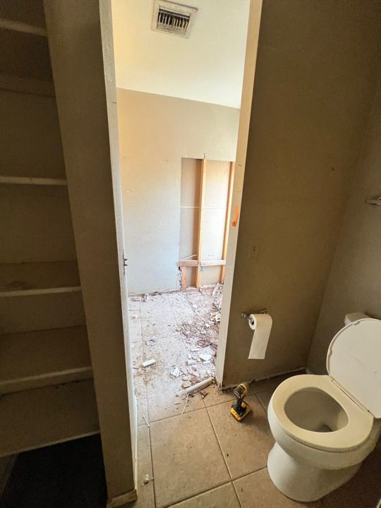 Linen closet and toilet
