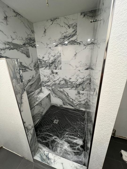 Shower tile going in