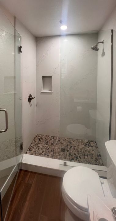 Walk-in shower with glass enclosure