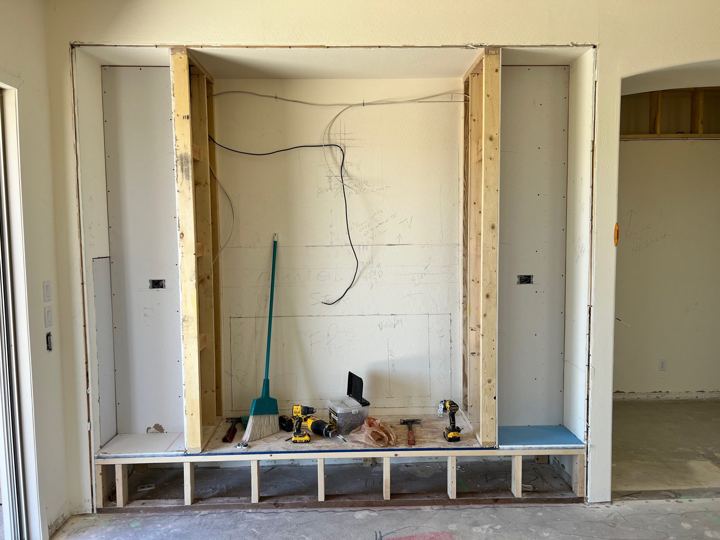 Fireplace wall stripped back