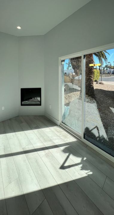 Living room with fireplace and slider