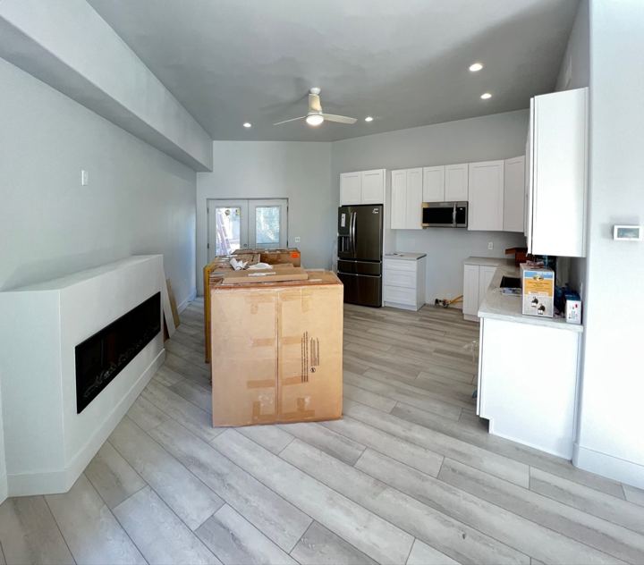 Fireplace wall and kitchen
