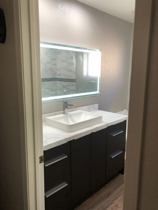 Vanity and lighted mirror