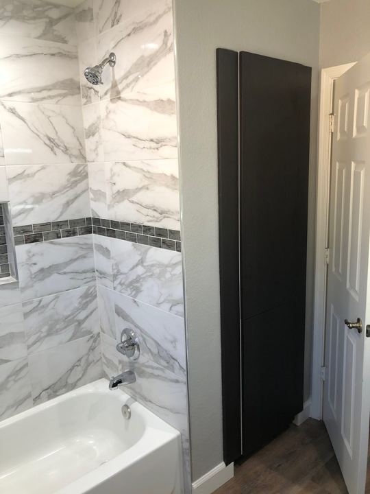 Tub surround and linen cabinet