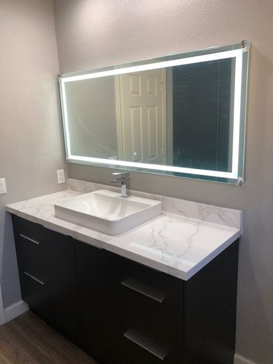Vanity with lighted mirror
