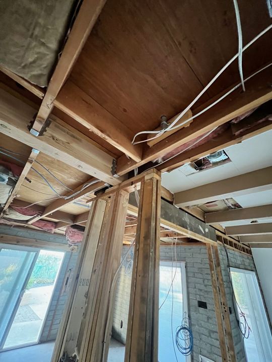 Ceilings and walls opened to the framing
