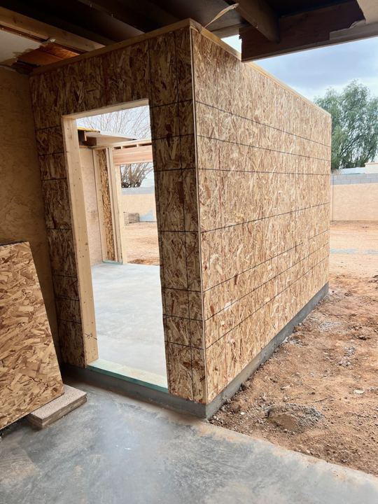 Patio enclosure framed and sheathed