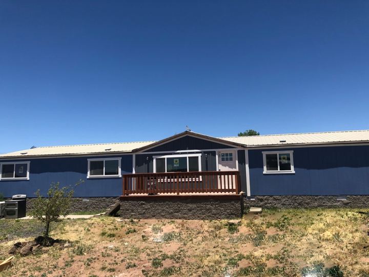 Back of the house with the new deck